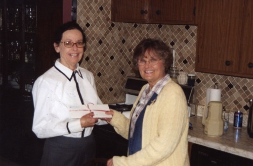 2006-11-20 Norma presents gift certificate to Margaret.jpg